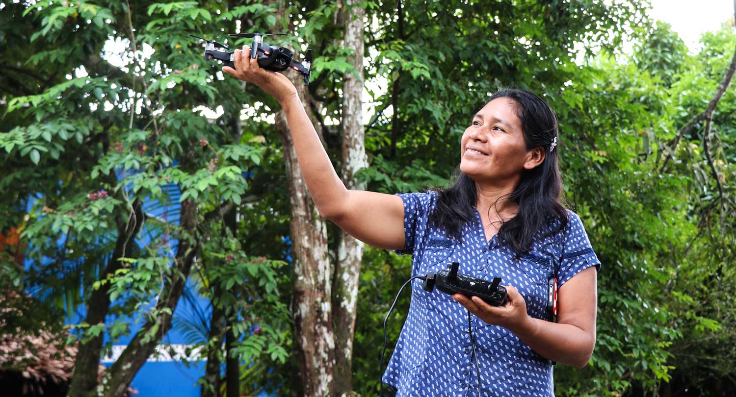 Betty Rubio Padilla demonstrates using a camera-equipped drone to investigate deforestation.