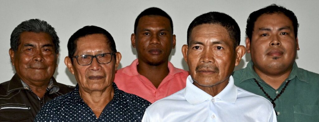 Leaders of Isseneru village stand together at a press conference