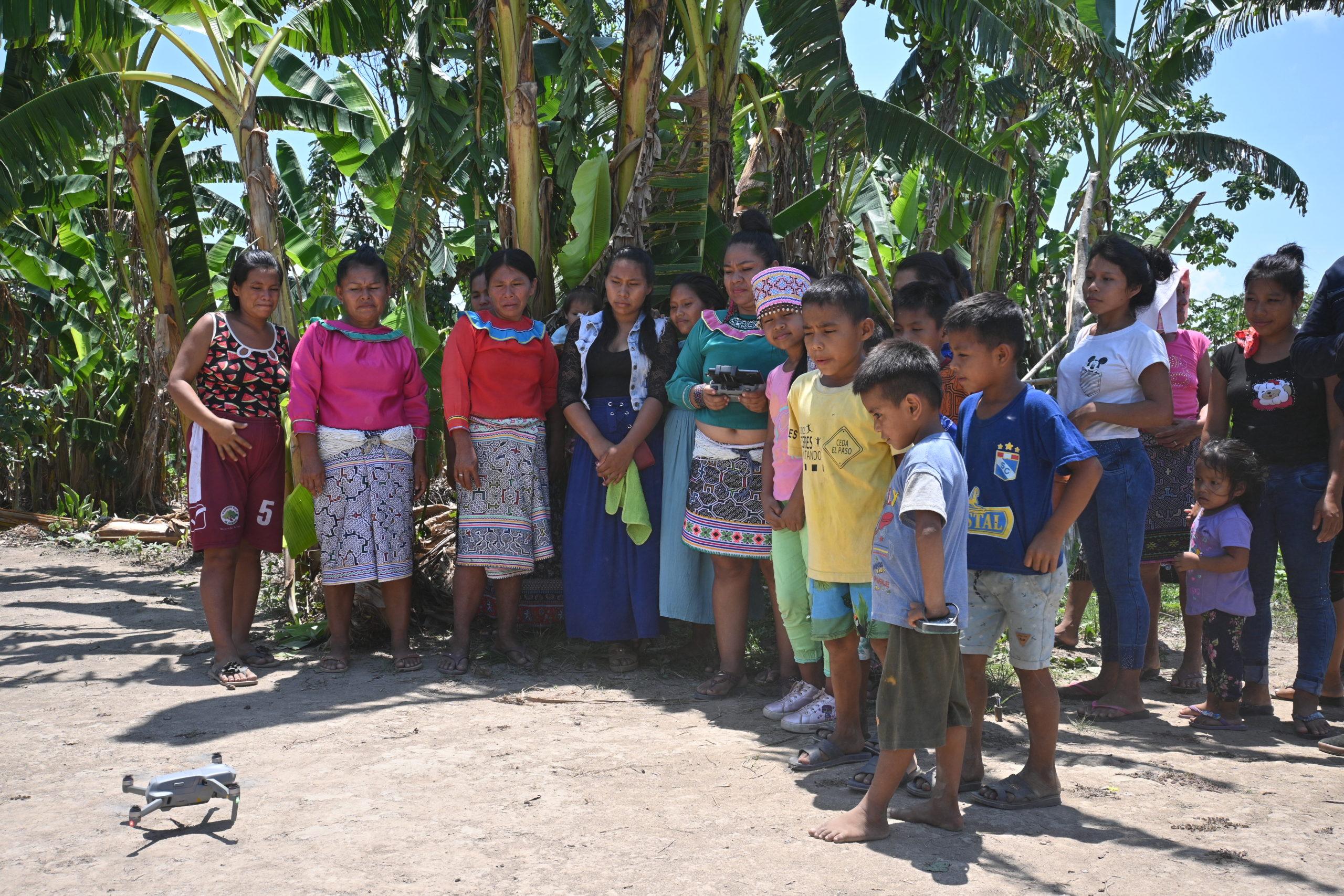 Forest Patrol Instructor Mirian Sanchez demonstrates drone technology to the residents of San Jose de Pacache