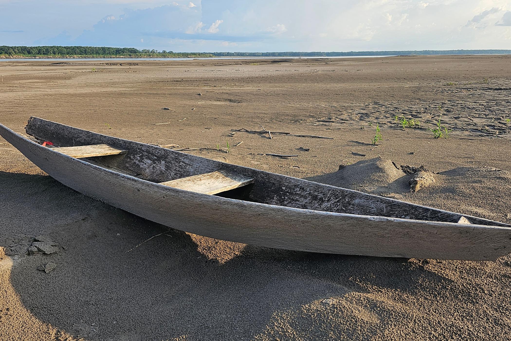 A wrecked canoe lies in the dry bed of the Amazon River near San Augusto, Peru. Photo: Plinio Pizango Hualinga l Rainforest Foundation US