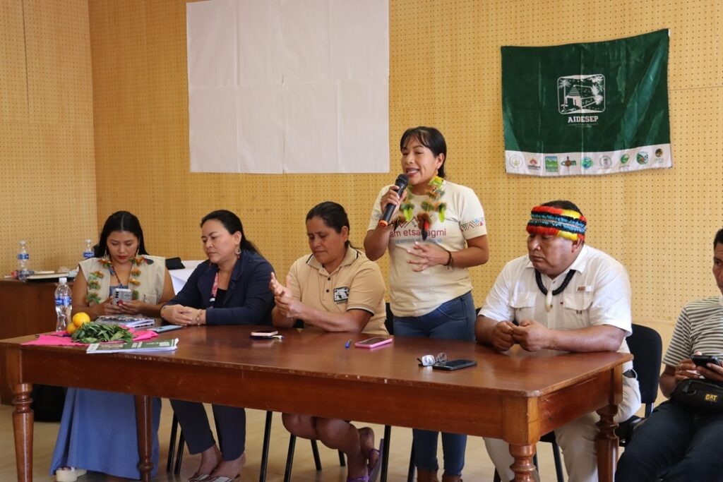 An Indigenous woman leader speaks during the event