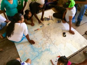 Members of Karisparu Village, Guyana, identify customary use areas on a map