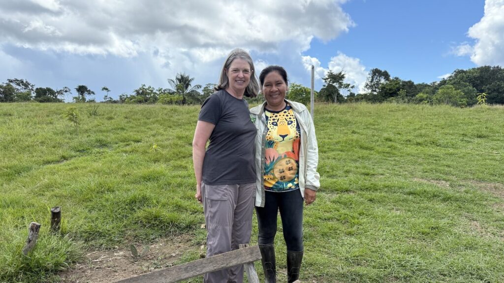 Forest advocate Jennifer Matthew and Indigenous woman monitor Betty Rubio stand together