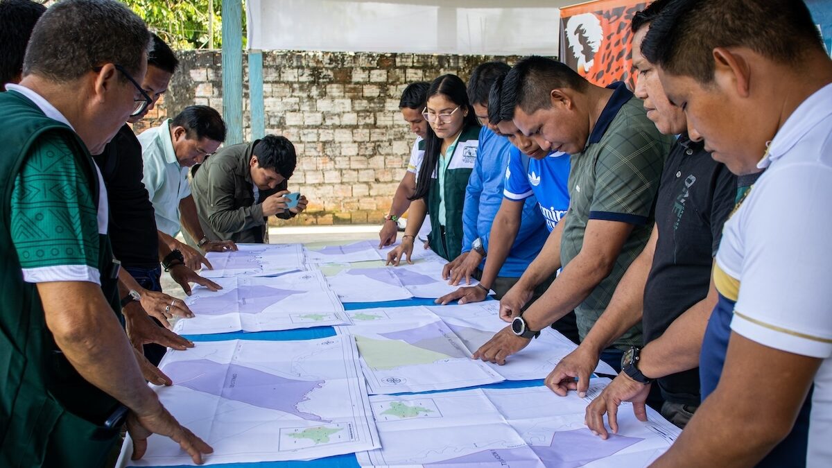 Leaders of the Indigenous communities review the maps of their territories 