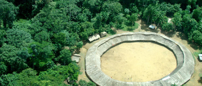 The circular communal building of the Watoriki Yanomami community in the middle of the Amazon rainforest in Roraima, Brazil