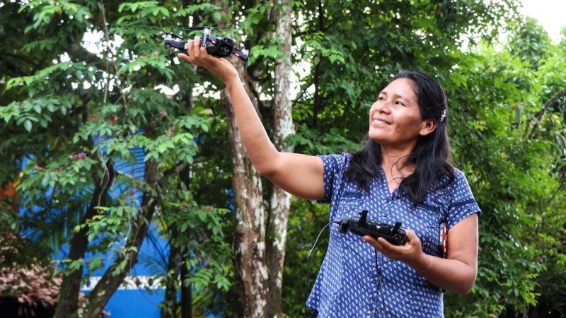 Betty Rubio Padilla demonstrates using a camera-equipped drone to investigate deforestation.