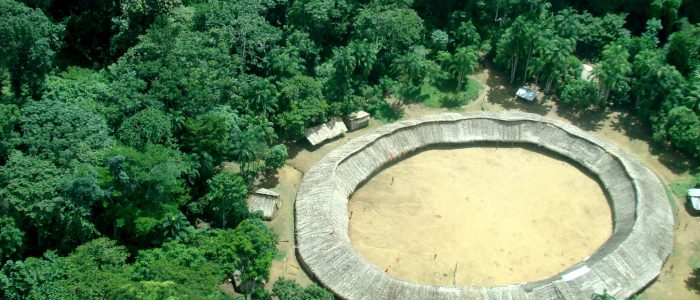 The circular communal building of the Watoriki Yanomami community in the middle of the Amazon rainforest in Roraima, Brazil