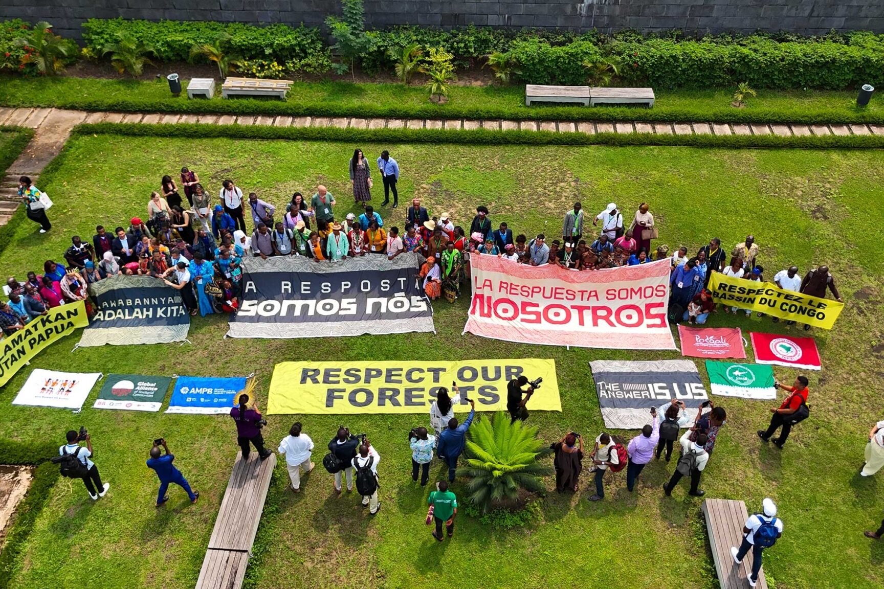 Building a Fairer Forest Finance System: Indigenous Leadership in the Tropical Forests Forever Facility  1 indigenous event aerial shot gathering banners med 2048x1152 1 edited