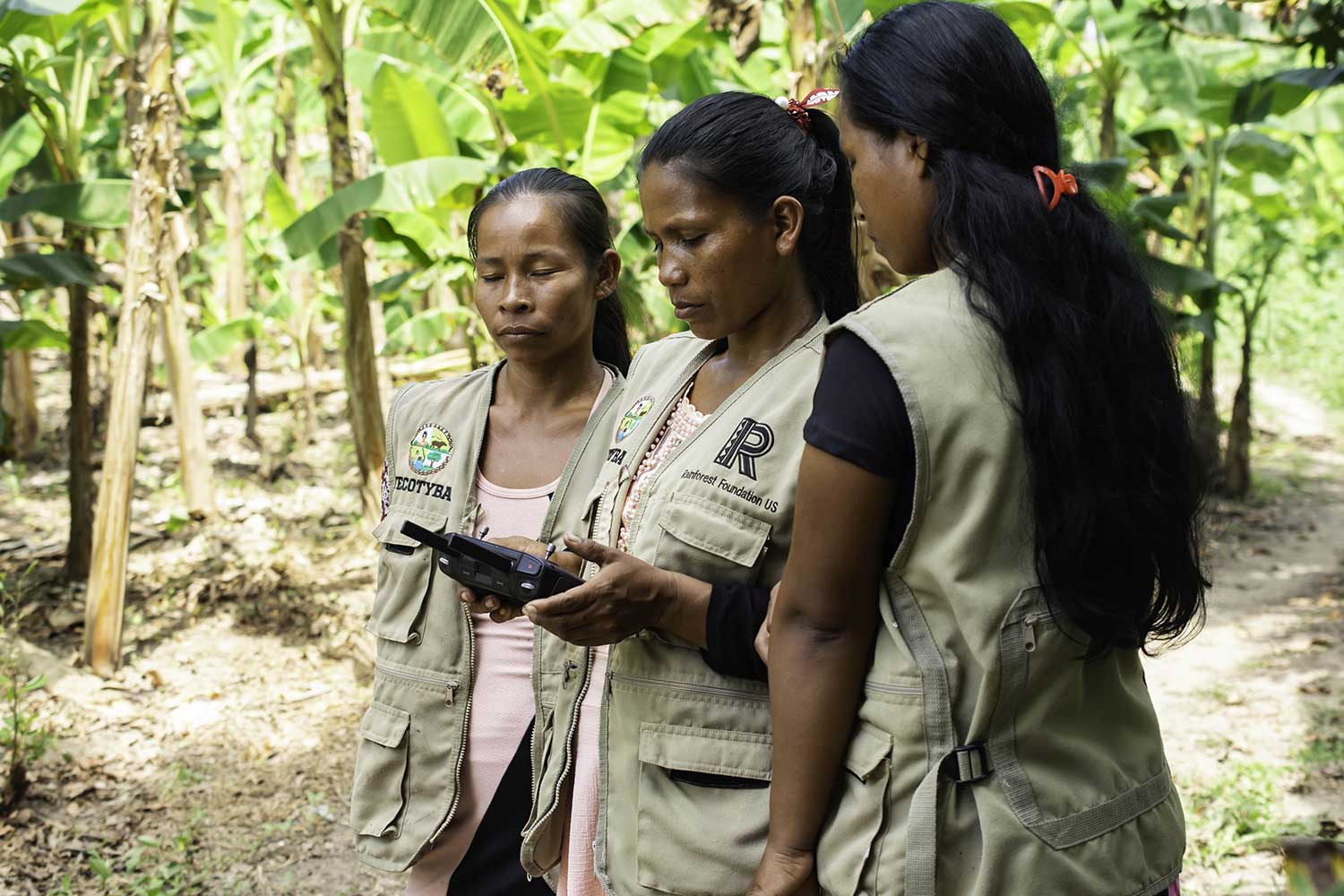 three-indigenous-women-forest-monitoring-drone-control-unit
